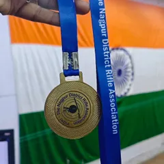 A close-up of the gold medal from the Nagpur District Rifle Association. Each medal represents countless hours of focus, discipline, and dedication from our shooters.