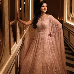 This bride looks like she stepped out of a dream. Her makeup is flawless, with a focus on creating a radiant glow that complements her ethereal gown and the magical ambiance.