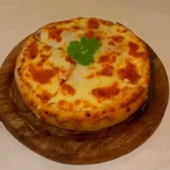 This cheesy, wood-fired pizza is perfect for sharing. The slightly charred crust and bubbly cheese make it an irresistible choice from our savory menu.
