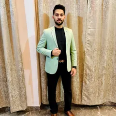 Dressed in a business casual blazer. I believe in achieving my dreams through dedication and hard work, and I bring that energy to my legal practice every day.