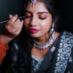 A close-up detail of the eye makeup for this reception look. I used warm, shimmery eyeshadows and precise eyeliner to create a captivating look that enhances the eyes.