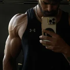 The result of a serious shoulder pump. We focus on hitting all three heads of the deltoid to build round, full, and vascular shoulders.