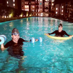 I offer sessions at various times, including these night classes. This workout combines aquatic dumbbells and a pool noodle for a full-body conditioning session under the lights.
