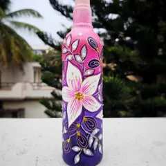 A closer look at the spontaneous floral bottle art. You can see the texture and the little details on the leaves and petals that make the design stand out.