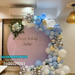 A beautiful birthday setup for Sailee in a cool blue, white, and silver palette. The round backdrop is perfect for home celebrations.
