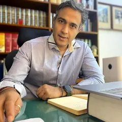 In my office, surrounded by the tools of my trade: law books and a commitment to rigorous preparation. I believe that success in litigation is not about drama, but about meticulous research and sharp legal strategy.