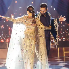 A beautiful moment from the couple's first dance, showcasing the intricate details of the bride's outfit and the pure happiness on their faces. We focus on creating choreography that allows for these picture perfect memories.