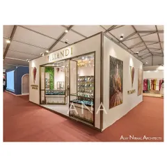 A three-quarter view of the Villandi '23 exhibition stall, showing the clean exterior walls used for branding and campaign imagery. The design presents a polished and complete architectural presence from all angles.