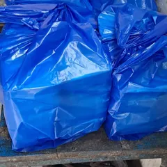 The final step: packed meal containers are organized into large bags for clean and efficient transport and delivery to the institution.