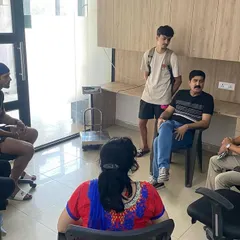 A collaborative session with parents and coaches. We believe that a supportive family environment is essential for the holistic development of our athletes.