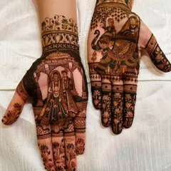 The deep color of the varmala and bride-on-elephant design, demonstrating the quality of my henna.