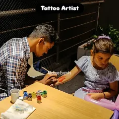 Another happy customer at the tattoo painting station. I provide a dedicated table and all the necessary supplies so the artist can work efficiently and the kids can get creative.