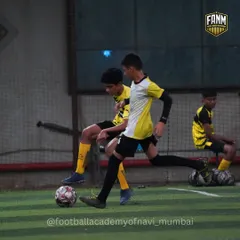 An intense moment from a practice game, with one player trying to dribble past another. These scenarios are crucial for developing both offensive and defensive skills.
