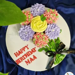 My special cupcake bouquets are a unique way to gift flowers and cake at the same time. This beautiful arrangement features a variety of piped flowers in different colors.