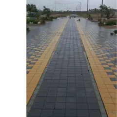 A patterned streetscape in a new layout development. We believe pedestrian-friendly streets are crucial for a connected community, and we use paving patterns to define walking zones and add character.