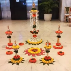 This traditional floor decoration was created for an office's Republic Day celebration. It features floral rangoli and decorated stands, showcasing how we can bring festive traditions into a corporate setting.