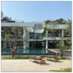 A panoramic view of a courtyard style house in Alibaug. Despite being inspired by urban architecture, this home is engulfed by botanical landscaping, retaining the easy-going overtone of the emergent neighborhood.