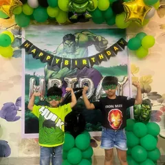 Look at these little superheroes enjoying their Hulk-themed birthday party. I created a full backdrop with a custom Hulk poster, a green and black balloon garland, and character foil balloons. Seeing the kids so happy and engaged with the decor is the best part of my job.