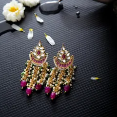 Elegant chandbali earrings with pink beads and pearls. I added water droplets and flower petals to create a fresh, artistic product shot that tells a story.