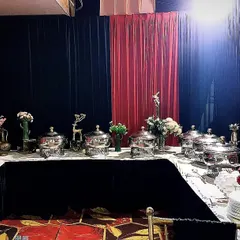 A dramatic black and red themed buffet setup for 100 guests. We work with you to match the presentation to your event's color scheme and style.