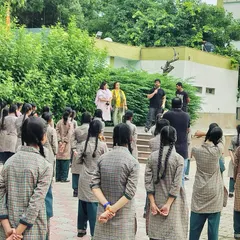 Addressing a group of young students before starting the practical training session. It is crucial to first explain the mindset of self-protection and personal safety.