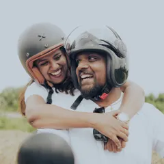 For adventurous couples, a pre-wedding shoot is all about capturing your personality. This candid shot from a biker-themed session shows the pure, unposed joy of just being together.