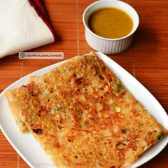 Our crispy Rava Dosa, made from semolina batter and folded neatly. It is served with a side of flavorful sambar, a popular choice for breakfast and tiffin services.