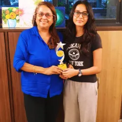 Posing with my student Zaisha and her well-deserved award. My students' success in their ICSE art exams makes me incredibly proud.