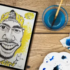 A cool and casual digital caricature, displayed on a wooden desk with my art supplies. The digital format allows for clean lines and vibrant, flat colors.