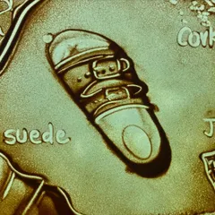 Another key moment in the Birkenstock sand animation, focusing on the final product. This visual emphasizes the brand's iconic design and heritage, created for a major corporate event to celebrate their legacy.