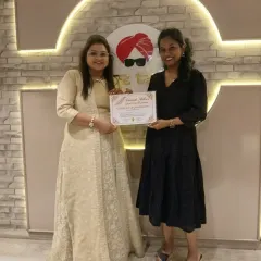 A proud moment presenting a certificate of completion to my talented student.