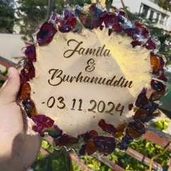 Your wedding flowers can last a lifetime. I preserved the petals of a ruby rose to create this custom resin plaque, complete with the couple's names and wedding date. It's a beautiful way to remember your special day.