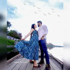 A playful, candid moment on a boat with the Taj Mahal in the background. This perspective offers a unique and serene view, perfect for capturing relaxed and joyful interactions.