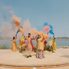A burst of color and joy for a fun-filled Haldi ceremony by the water. We love creating these high-energy moments with vibrant decor and playful elements like color bombs that make for unforgettable memories.