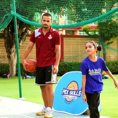 My role as a coach goes beyond drills and strategy. It's about mentorship and skill development. Here, I am with a young player, providing the personalized guidance that helps build both a better athlete and a more confident individual.