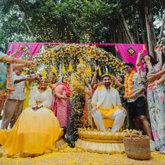 The pure, uninhibited joy of a Haldi ceremony, with friends and family showering the couple in a sea of marigold petals. I plan celebrations that are vibrant, fun, and full of laughter.