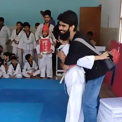For me, coaching is more than teaching kicks and punches. It's about building trust and being a shield for my students, celebrating their courage in every step of their Taekwondo journey.