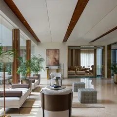 This perspective of the Celadon residence showcases how light, water, and materiality converge. The design allows nature to flow effortlessly into the built form, with the formal lounge opening up to views of the internal courtyard and koi pond, blurring the threshold between interior and exterior.