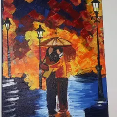 A romantic painting of a couple embracing under an umbrella on a rainy night. The warm, fiery colours of the sky contrast with the cool blues of the street, creating a passionate and intimate scene.