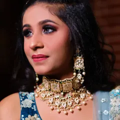 This close-up highlights the precision of the eye makeup and the contouring that defines the client's features. The jewelry is also from my rental collection.