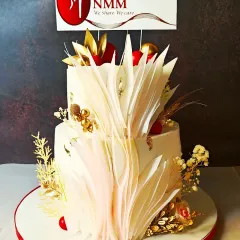 Another view of the Navi Mumbai Moms event cake, showcasing the intricate wafer paper art and red and gold color scheme that matched their "red party" theme.