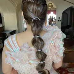 The full view of this stunning and unique bridal braid. It's a great way to keep your hair managed while still having a major style moment.