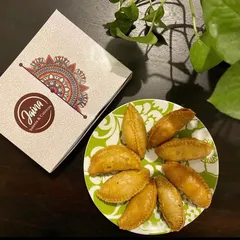 Our delicious, crispy Gujiyas served fresh and ready to be enjoyed. They come packed in our signature boxes, making them a great Holi gift.