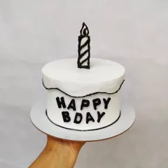 A monochrome comic cake. The black and white design is really striking and modern, and it's made with zero fondant.
