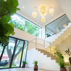 Welcome in. I wanted to create a space filled with natural light, clean lines, and plenty of plants. This is a glimpse of our Indiranagar cafe's Japandi-inspired staircase and airy, two-story design.
