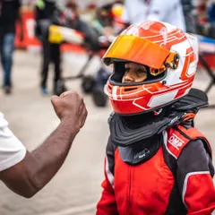 A fist bump of encouragement for one of our youngest drivers. Building confidence is as important as building speed.