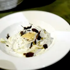 The final plated dish from our Italian Pasta Studio: fresh fettuccine with a creamy parmesan sauce, finished with shavings of French black truffle. It’s a simple yet luxurious dish that is always a guest favorite.
