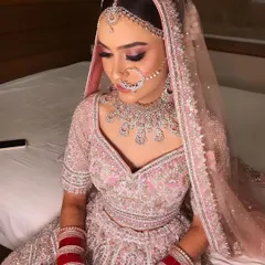 A bride in pink is always a beautiful sight. I created a soft, romantic look with pink shimmery eyes for her pastel lehenga.