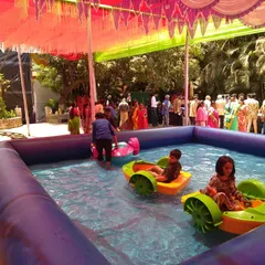 A paddle boat setup for a party in Thane. The boats are safe and provide hours of entertainment for kids in the inflatable pool.