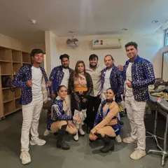 Backstage with my team of professional dancers before a corporate performance. I bring in talented artists to add a high-energy, polished look to your company's event.